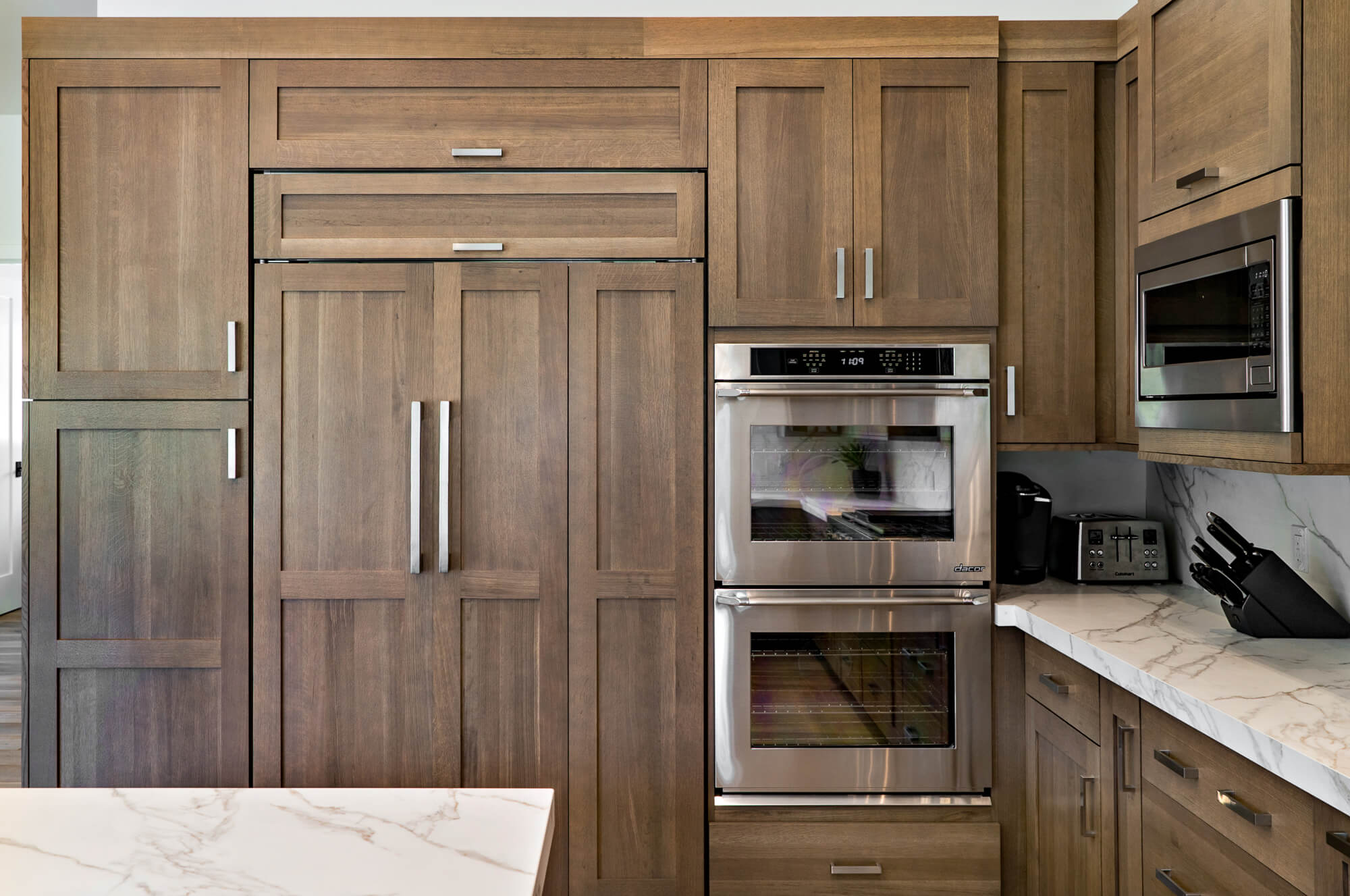 Floor to ceiling wood finish kitchen cabinetry