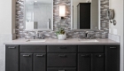 Bathroom Double sink and mirrors with wooden cabinetry