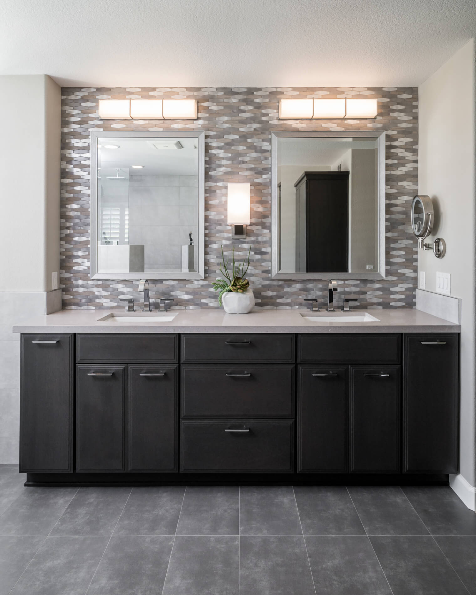 Bathroom Double sink and mirrors with wooden cabinetry