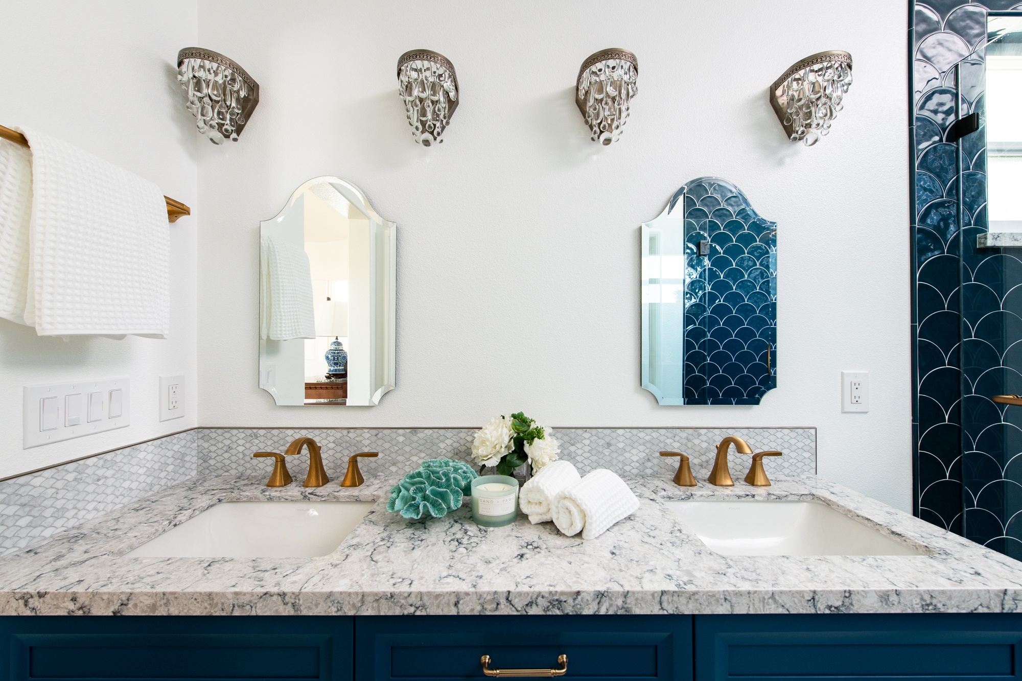 Master-bathroom-quartz-stone-countertops-with-custom-blue-painted-cabinetry-in-bathroom-remodel - bring color into the bathroom