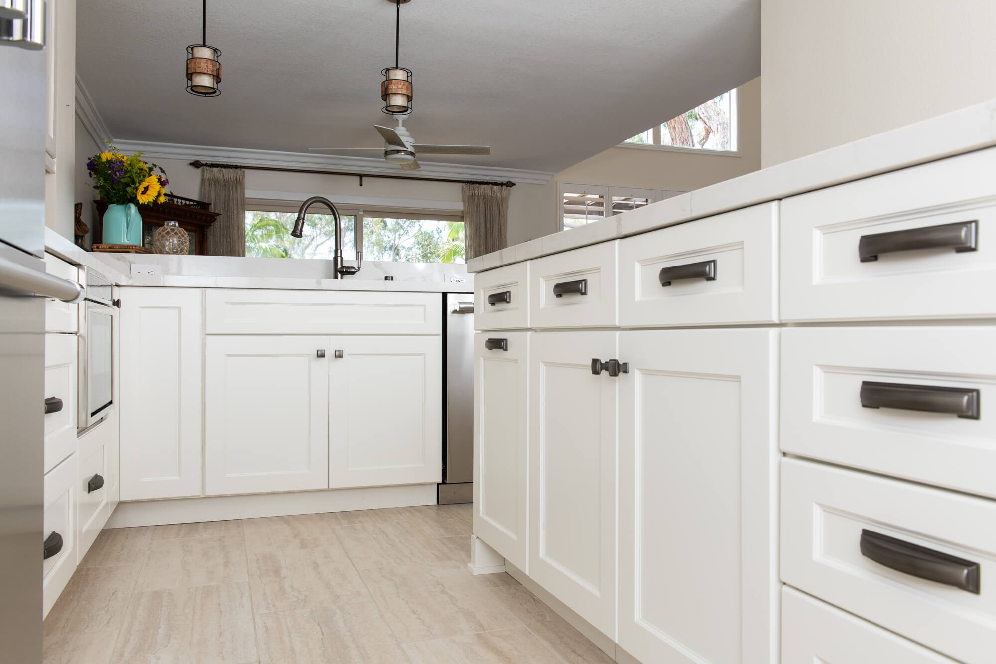 Kitchen Remodel With White Cabinetry on Perimeter and Island