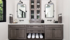 Dual vanity remodel with built-in open shelving for storing towels