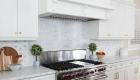 Geometric marble backsplash in kitchen remodel