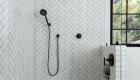 Large walk-in shower remodel with herringbone tile and linear drain