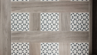 Porcelain Elysium flooring with patterned tile accents in bathroom remodel