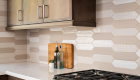 Porcelain tile geometric backsplash with seamless design in kitchen remodel