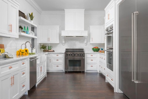 A white kitchen with stainless steel appliances