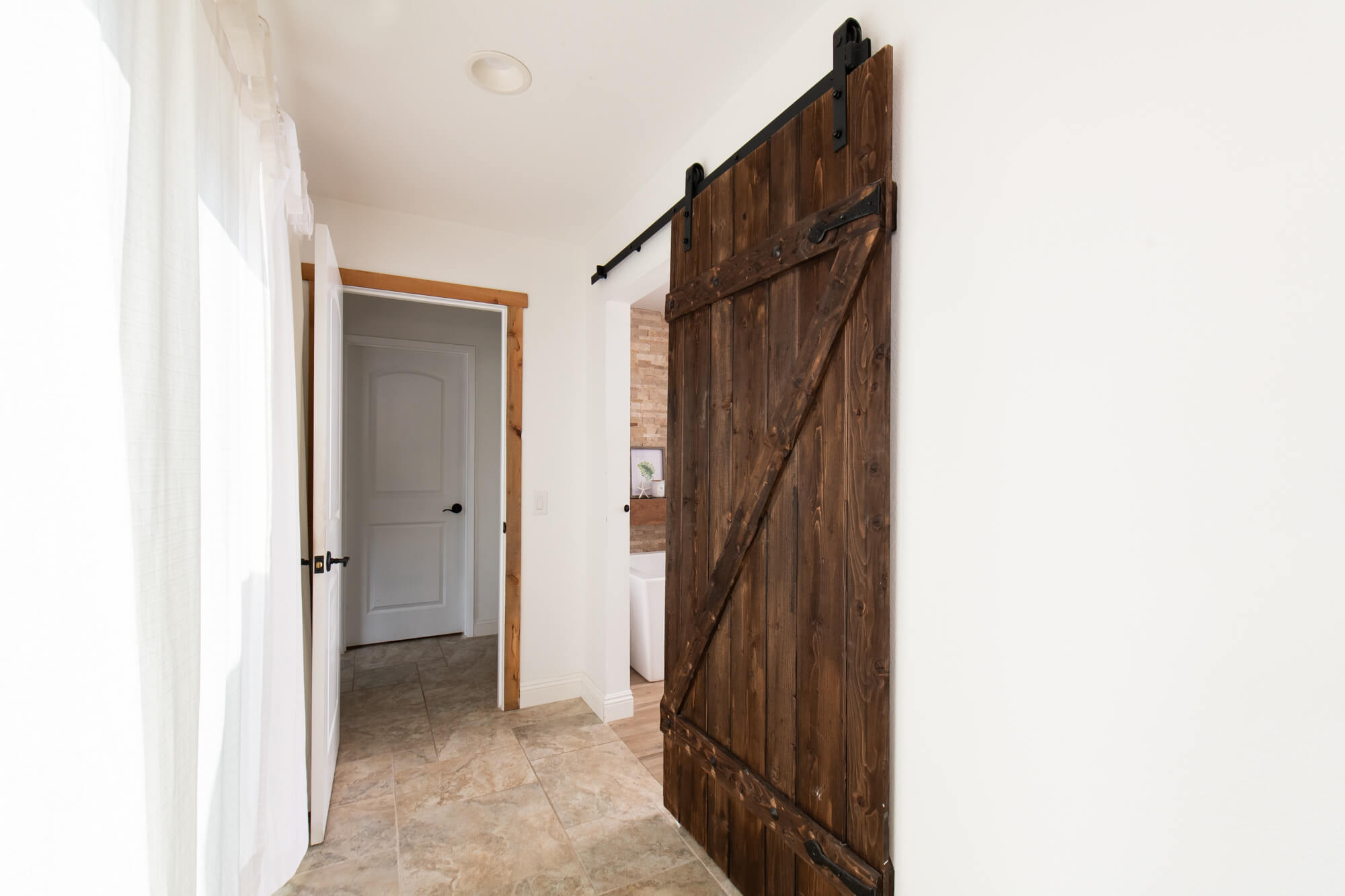 Master bathroom remodel with barn door entrance