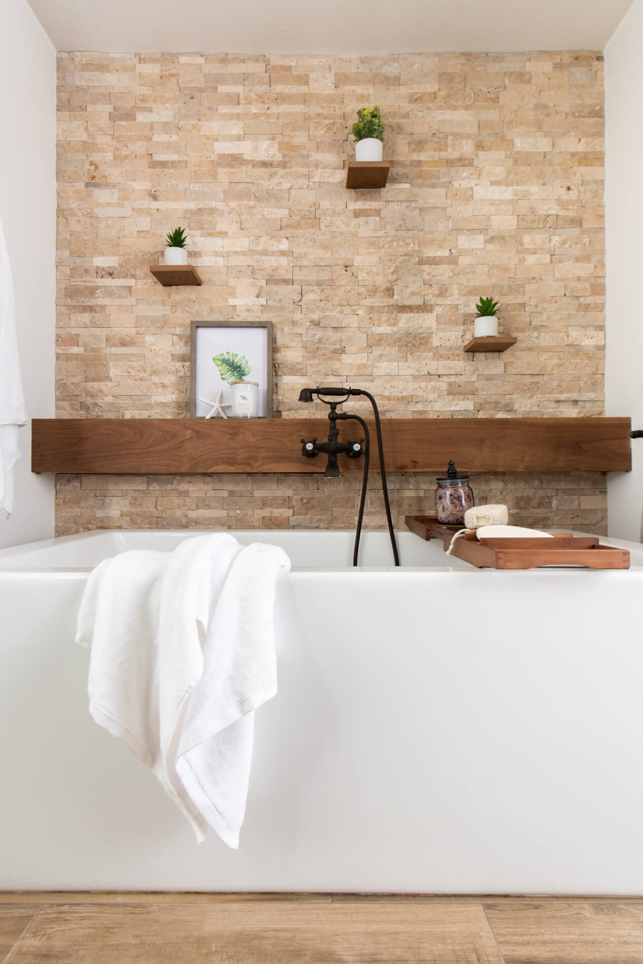Farmhouse Style Bathroom Remodel with Floating Shelves And Textured Stone Accent Wall