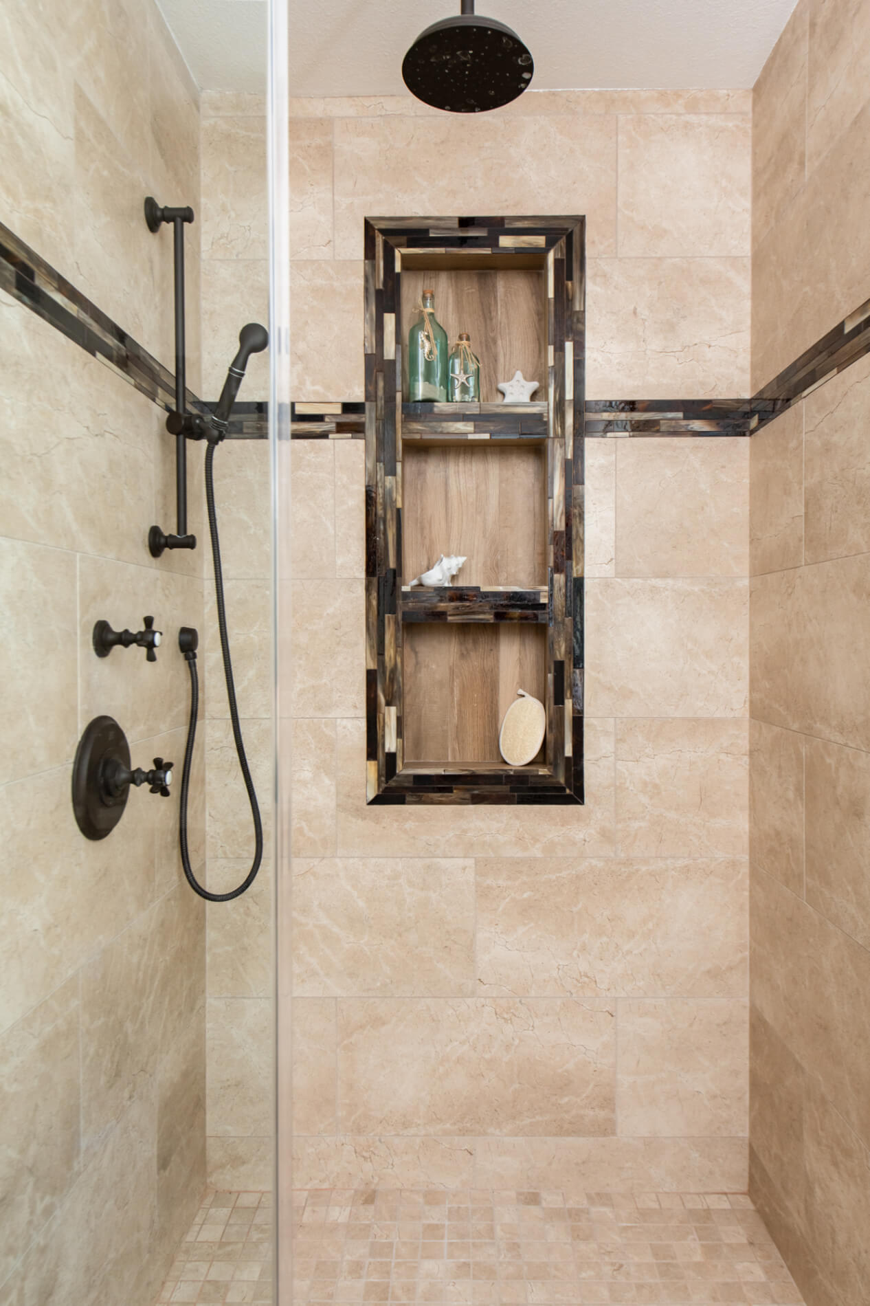 Walk-in shower remodel with eclectic design and shampoo niche accents