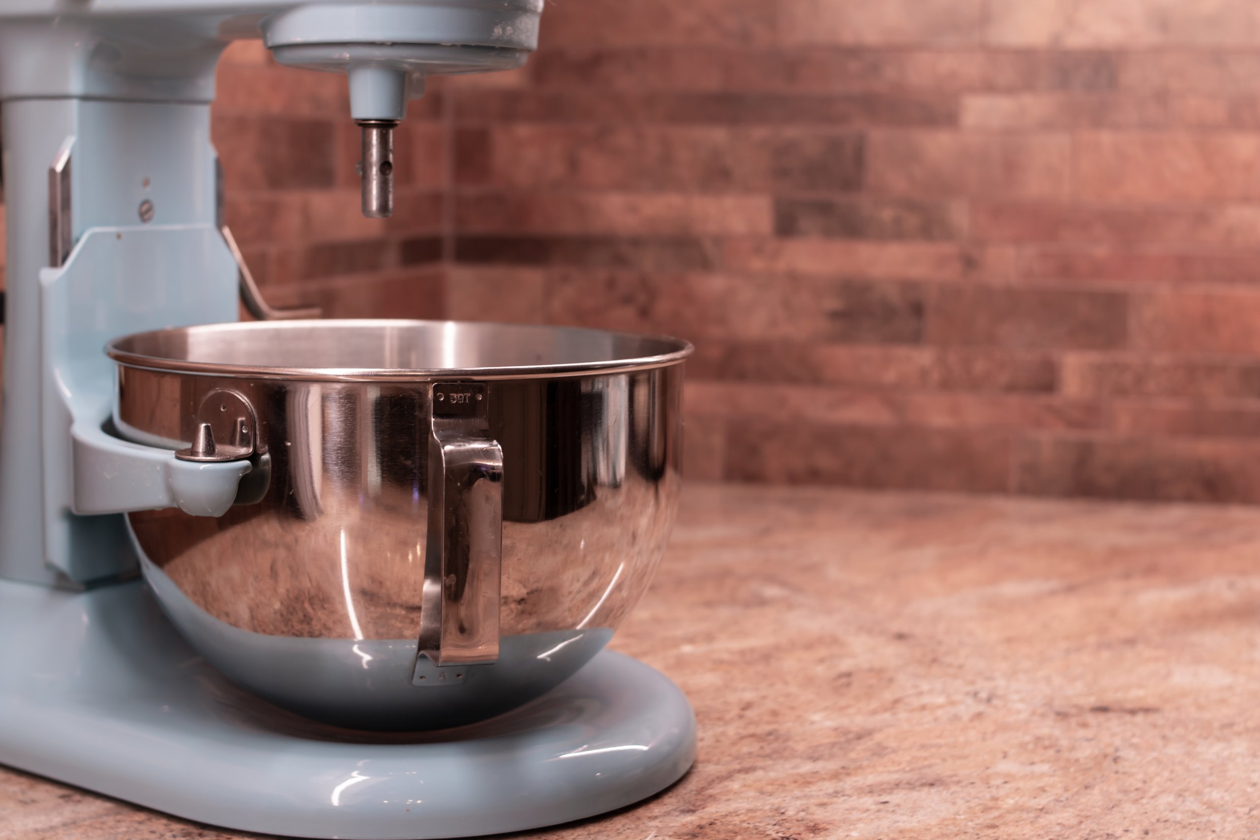 Mixing bowl and terracotta kitchen backsplash