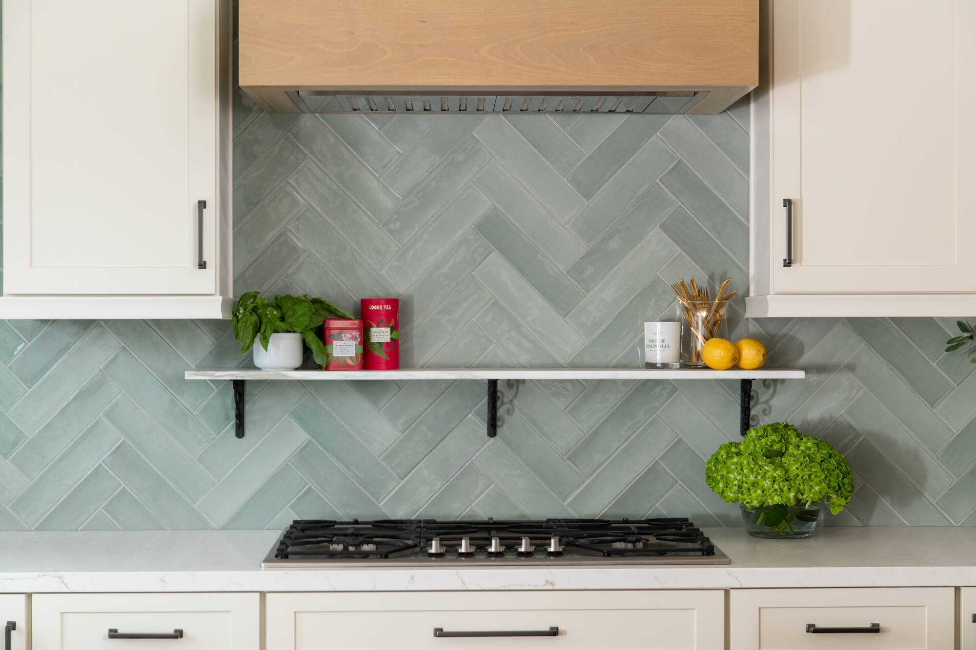 Blue-herringbone-tile-backsplash-in-kitchen-remodel