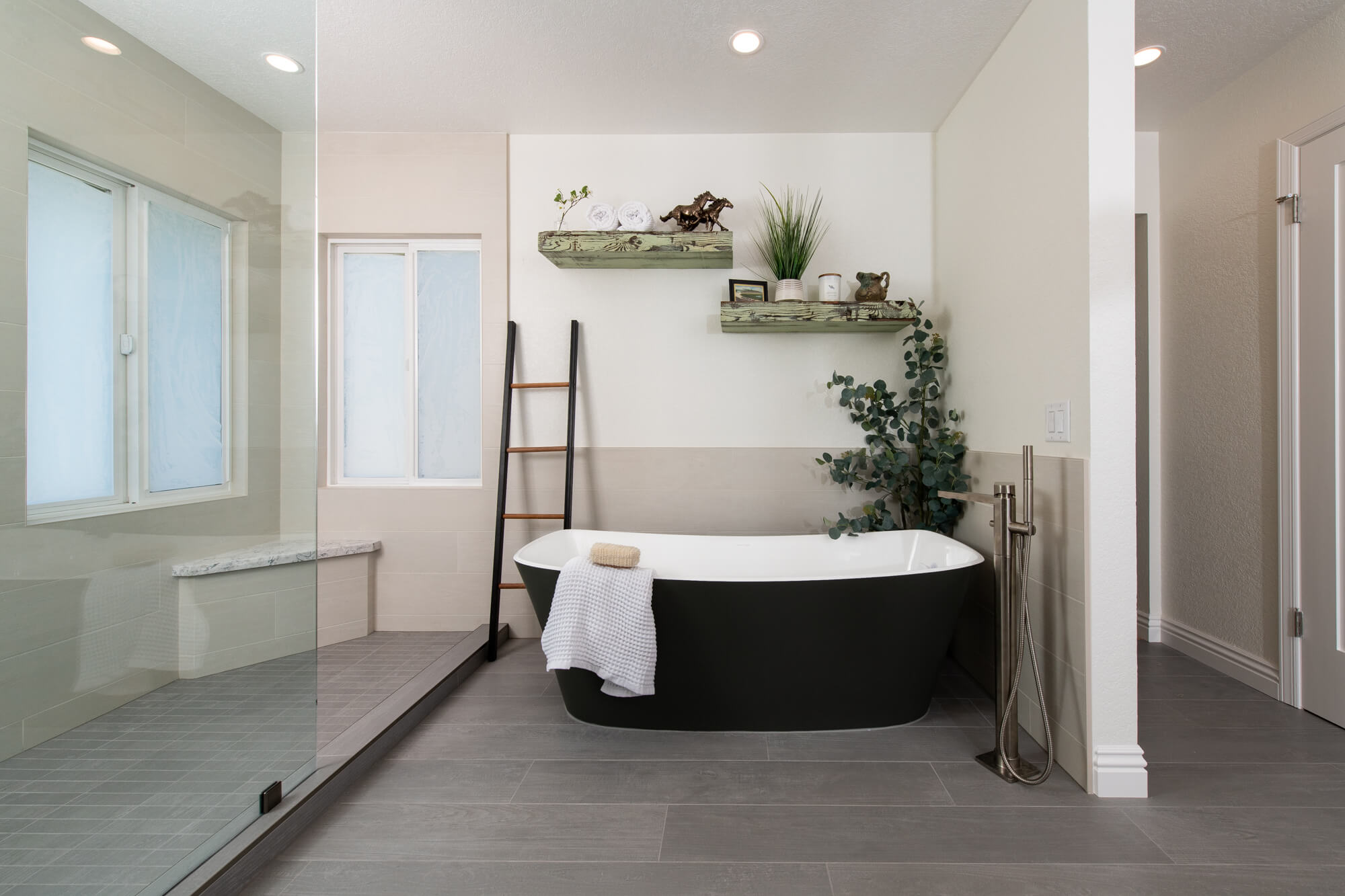 Primary-bathroom-remodel-with-large-walk-in-shower-and-freestanding-tub - bathroom design trends