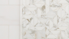 Marble chevron pattern accent design in shower remodel