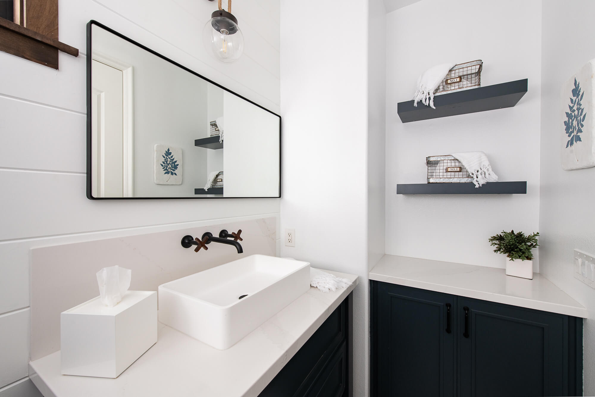 magnolia-matte-stone-vessel-sink-white-quartz-stone-countertop - remodeling a small bathroom