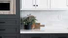 quartz-stone-countertop-custom-grey-and-white-shaker-cabinets-ceramic-backsplash