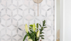 white-quartz-countertop-with-flower-patterned-mosaic-marble-tile-accent-wall