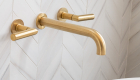 wall-mounted-tub-filler-and-schluter-trim-in-satin-gold
