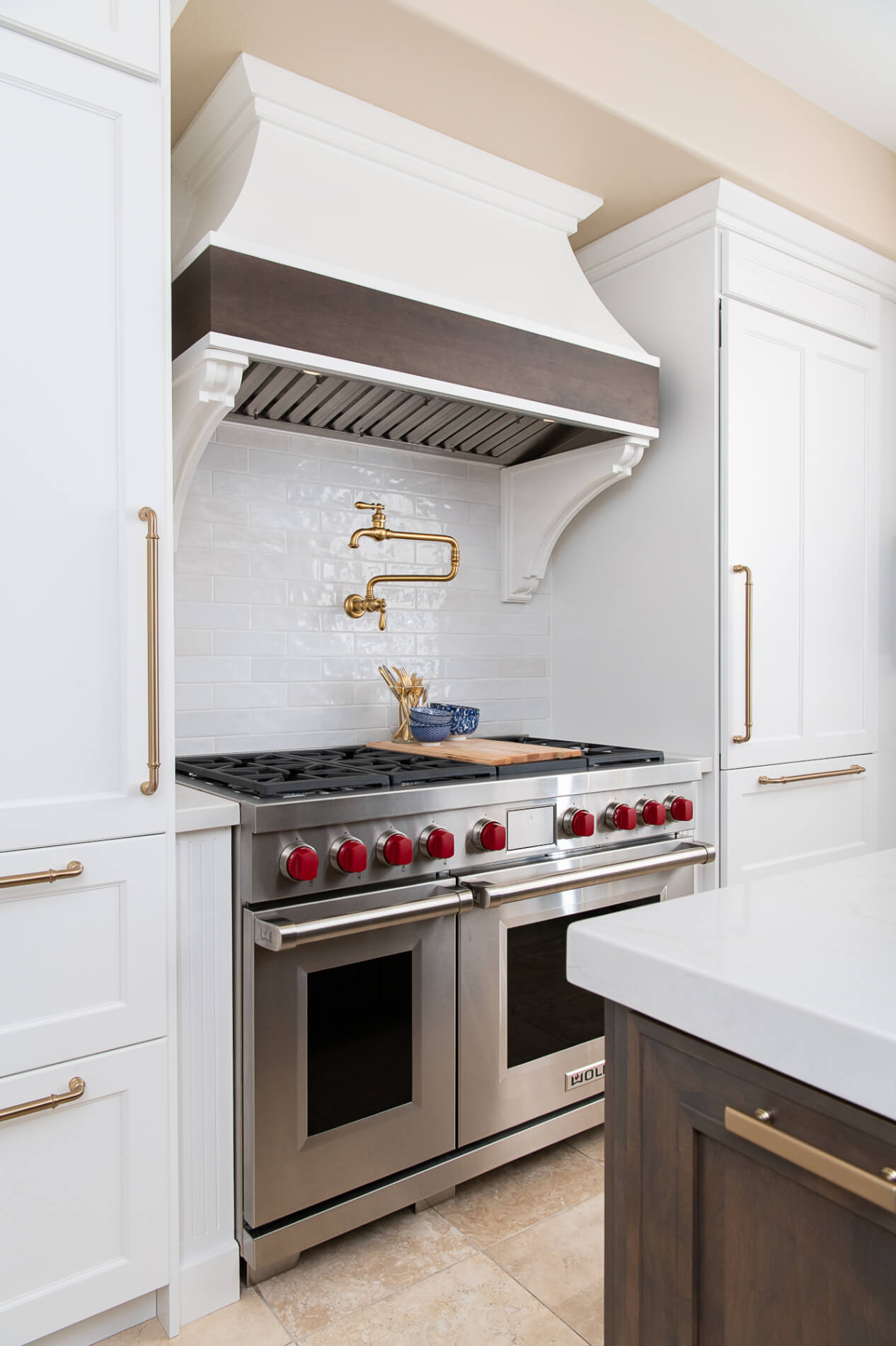 14-custom-curved-hood-with-large-wooden-corbels-over-slide-in-range