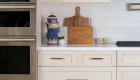 Oyster-white-cabinets-with-honey-bronze-pulls