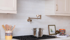 stainless-steel-hood-and-Delta-contemporary-wall-mount-pot-filler-faucet-champagne-bronze