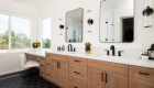 Side-view-fluted-vanity-sconce-and-rectangular-mirrors-with-rounded-edges-matte-black