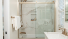 shower-niche-Emser-Rezone-white-porcelain-mosaic-hex-pattern-with-brushed-brass-schluter-trim
