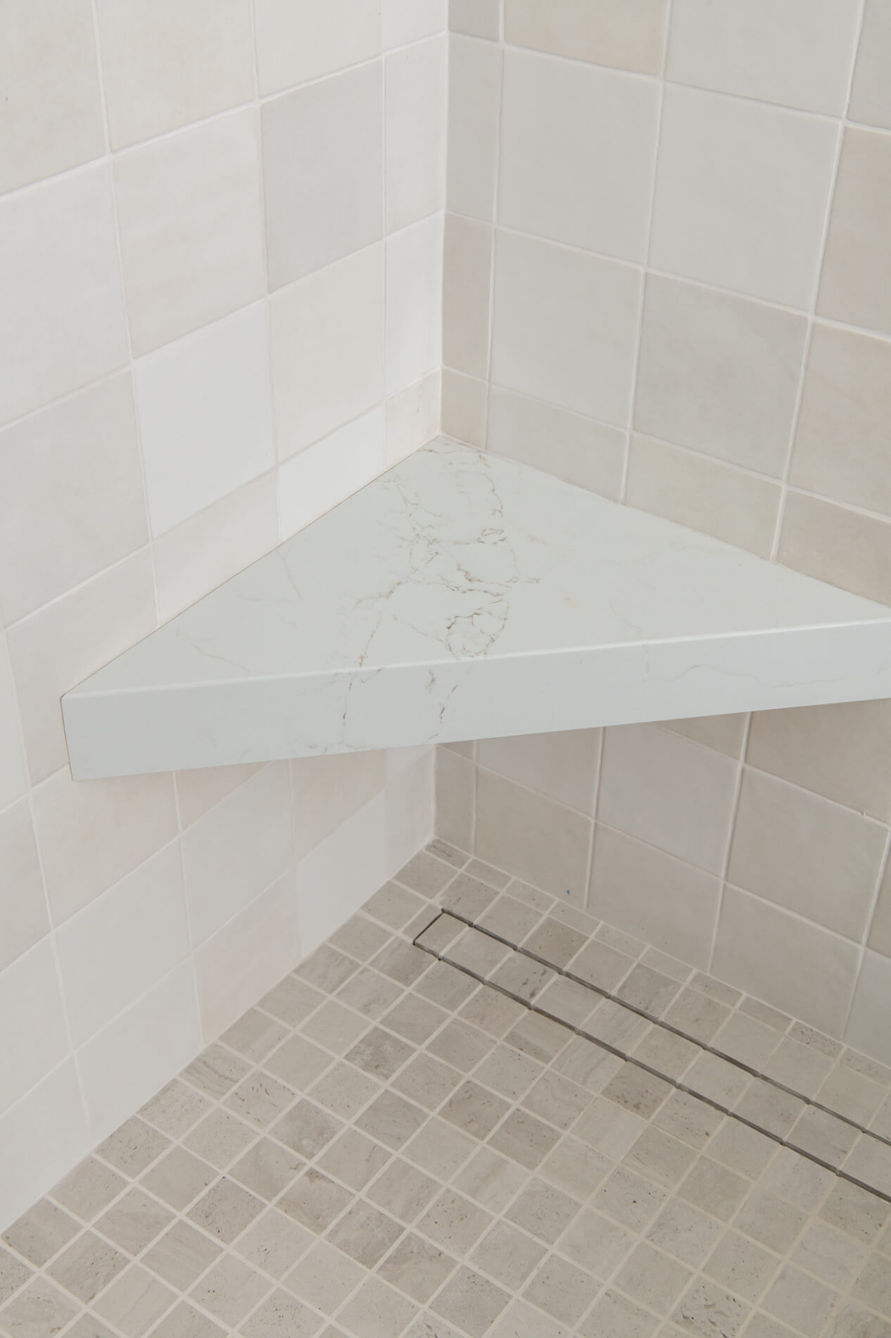 linear-shower-drain-in-Blanco-porcelain-2x2-tile-flooring