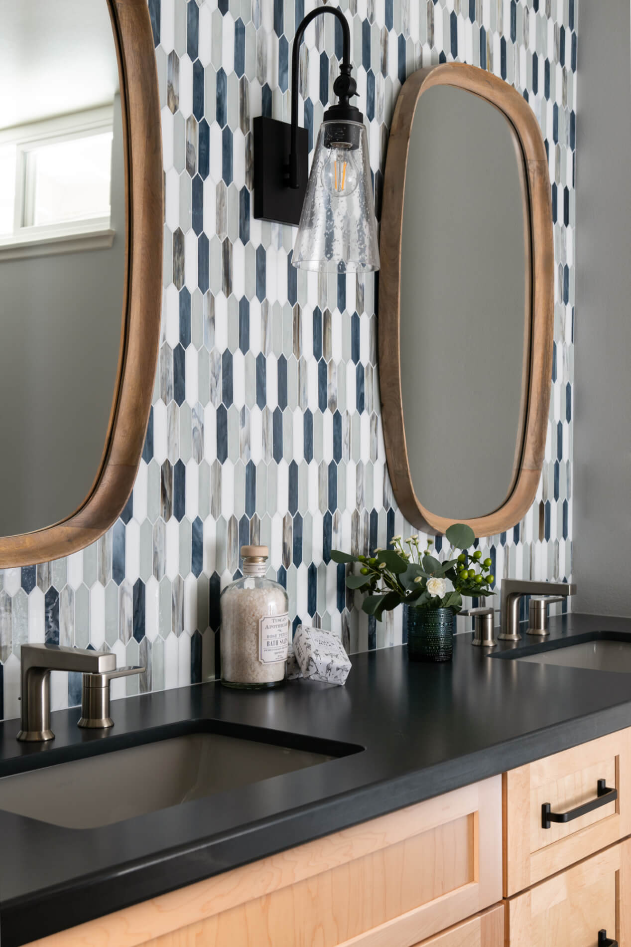 brushed-nickel-widespread-faucet-undermount-sink-arched-neck-glass-wall-sconce-black-light-wood-rectangular-mirrors