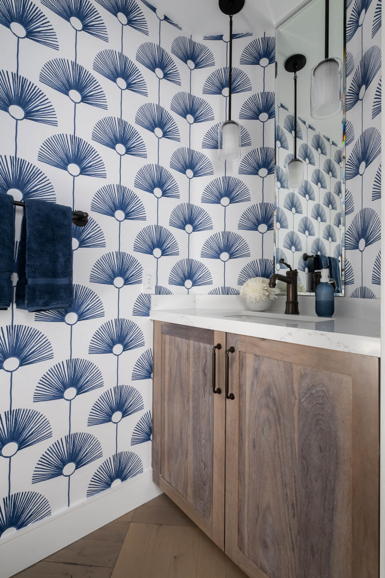 two-single-light-steel-bronze-pendants-hover-over-the-vanity-including-an-oil-rubbed-bronze-faucet-with-top-mounted-handle-and-an-undermount-sink