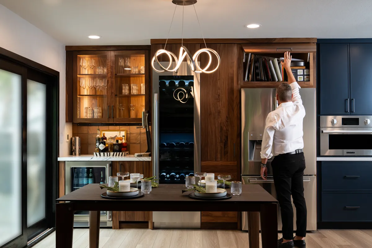 sea-pointe-design-and-remodel-custom-cabinetry-includes-a-garage-door-with-inserts-for-organizing-cooking-accessories