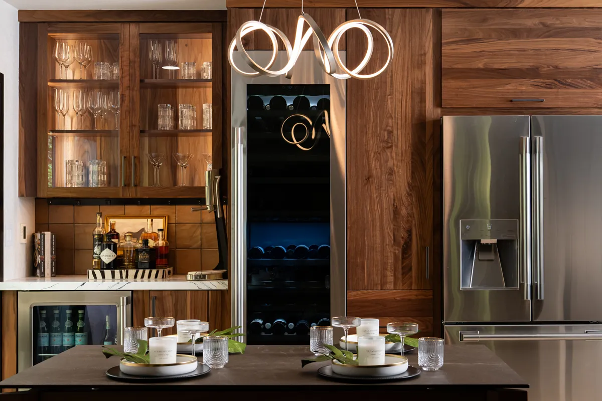 sea-pointe-design-and-remodel-customized-bar-featuring-Omega-walnut-cabinetry-in-a-natural-finish-and-glass-inserts