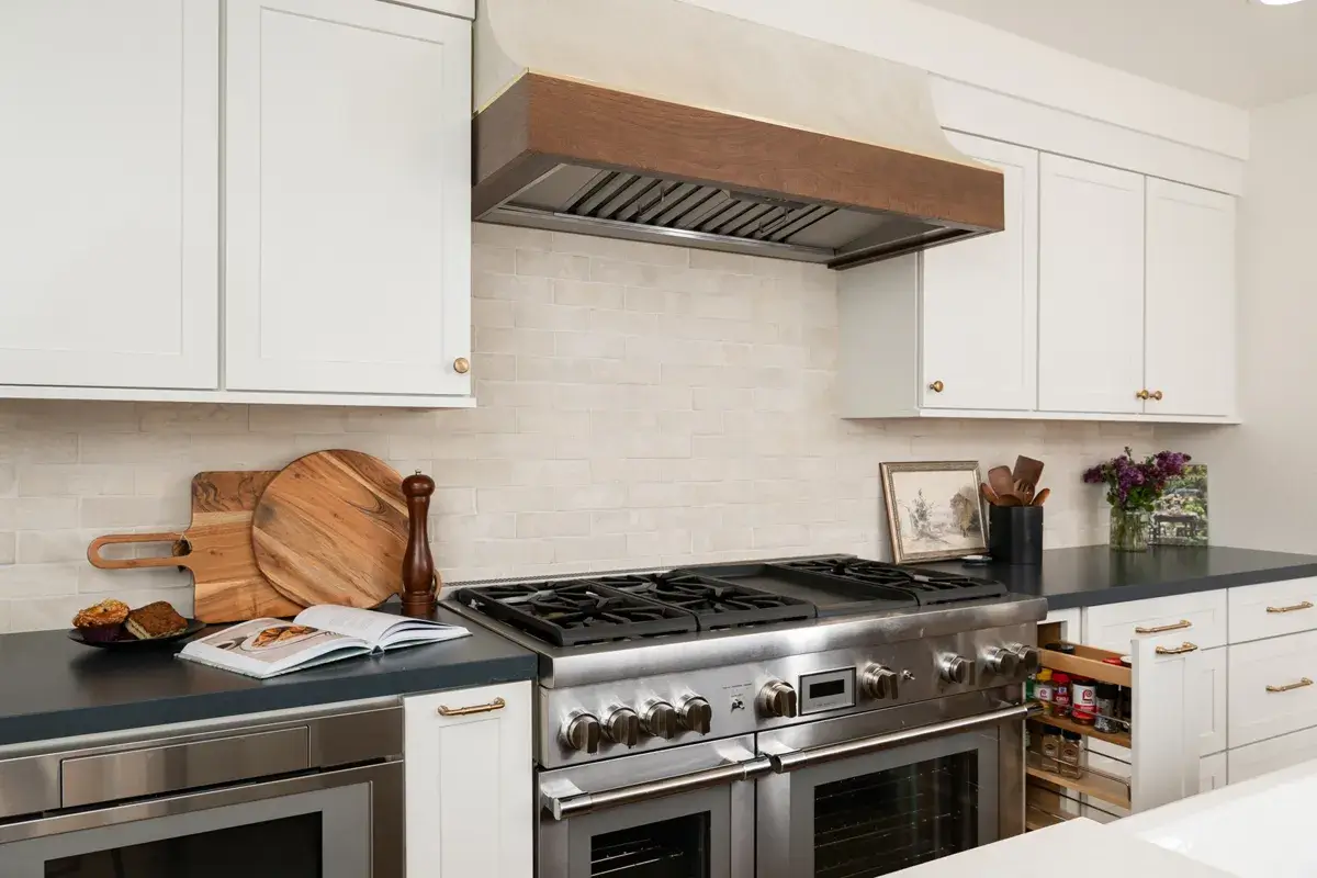4-Sea-Pointe-Design-and-Remodel-custom-cabinetry-including-a-spice-rack-next-to-double-oven-range