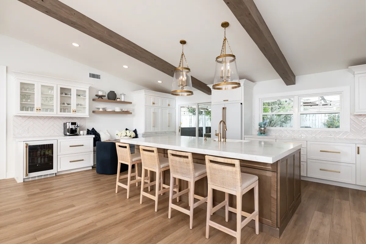 sea-pointe-design-and-remodel-island-cabinetry-in-Almond-finish-with-white-undermount-single-bowl-sink-and-Luxe-Gold-sinlgehandle-pull-down-faucet-and-soap-dispenser