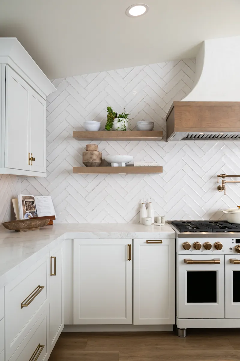 sea-pointe-design-and-remodel-perimeter-maple-cabinetry-by-Waypointe-in-Painted-Linen-finish-with-honey-bronze-pulls