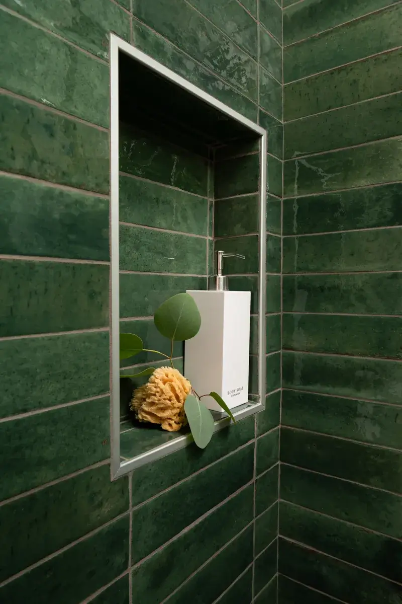 Sea-Pointe-Design-And-Remodel-shower-niche-with-metal-trim