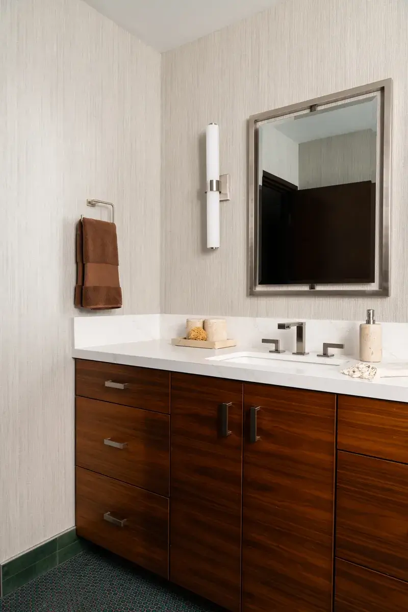 Sea-Pointe-Design-And-Remodel-single-white-undermount-sink-with-Luxe-nickel-widespread-bathroom-faucet