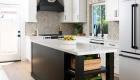 sea-pointe-design-and-remodel-waypoint-maple-cabinetry-kitchen-island-and-hood-in-painted-black-with-silver-pulls