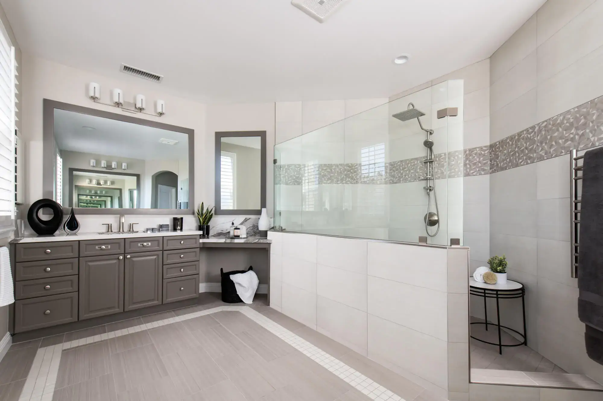 Bathroom remodel with porcelain tile flooring with accent