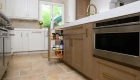 island-includes-custom-pull-out-cabinetry-and-built-in-microwave