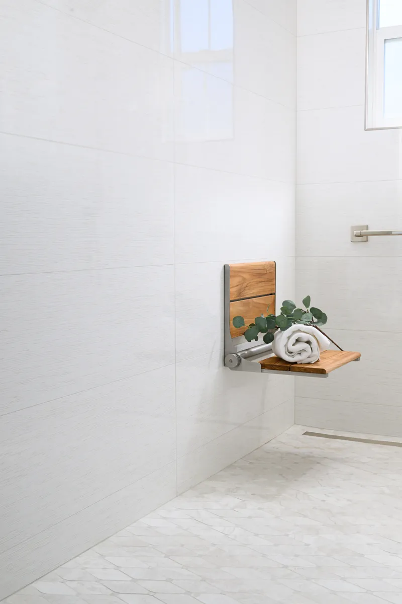 ADA-grab-bar-and-fold-down-teac-shower-seat-with-brushed-nickel-hinge