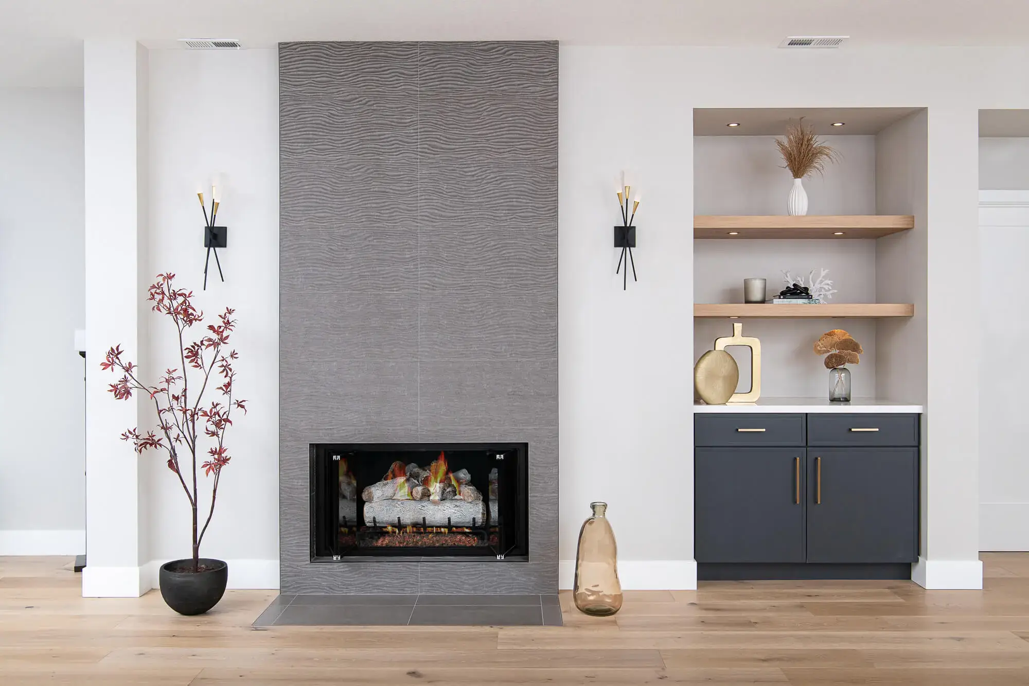 dark-gray-porcelain-fireplace-wall-tile-tri-band-pendant-lights