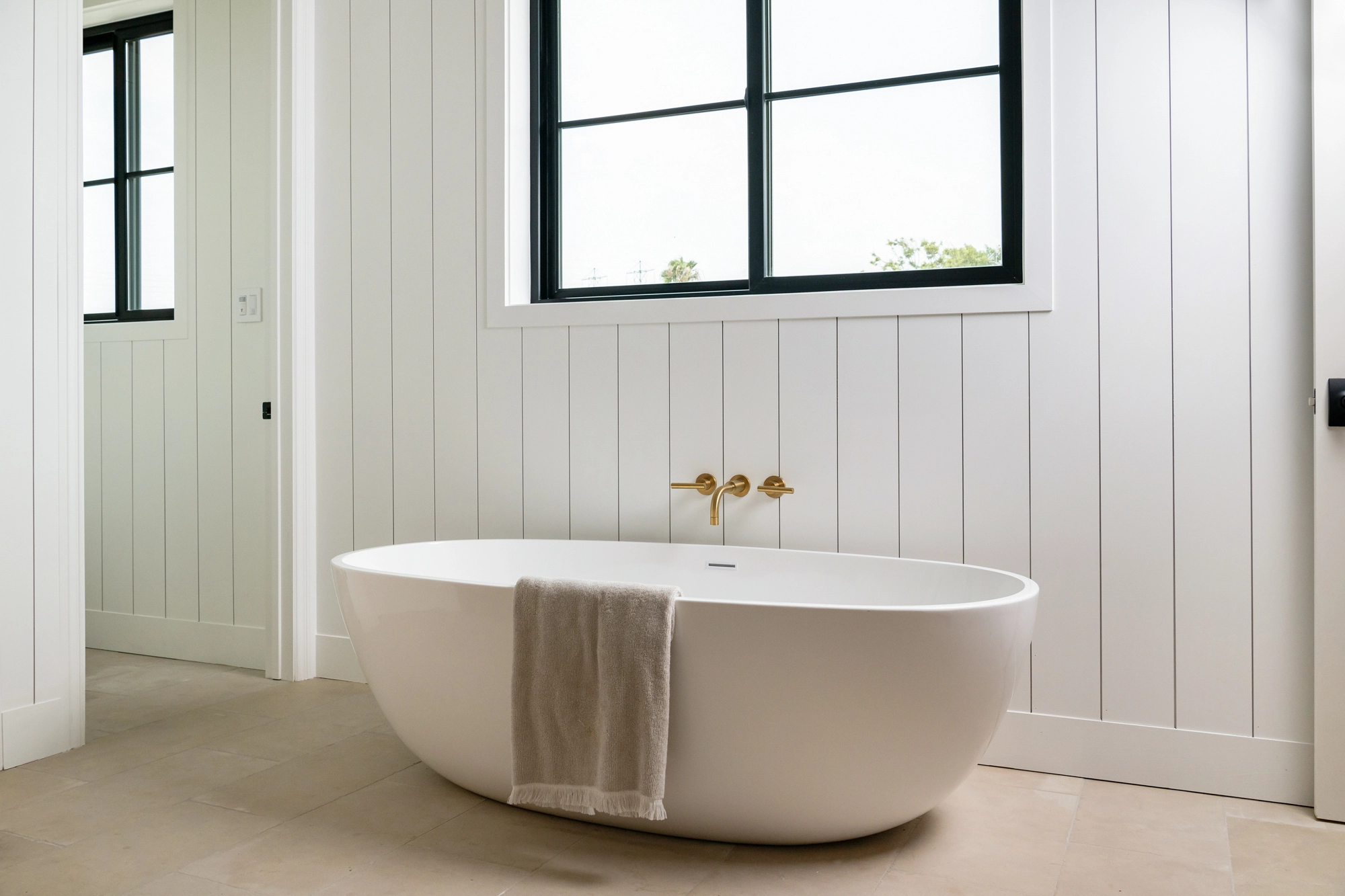 A freestanding soaking tub makes a centerpiece in 2026 bathroom remodeling trends