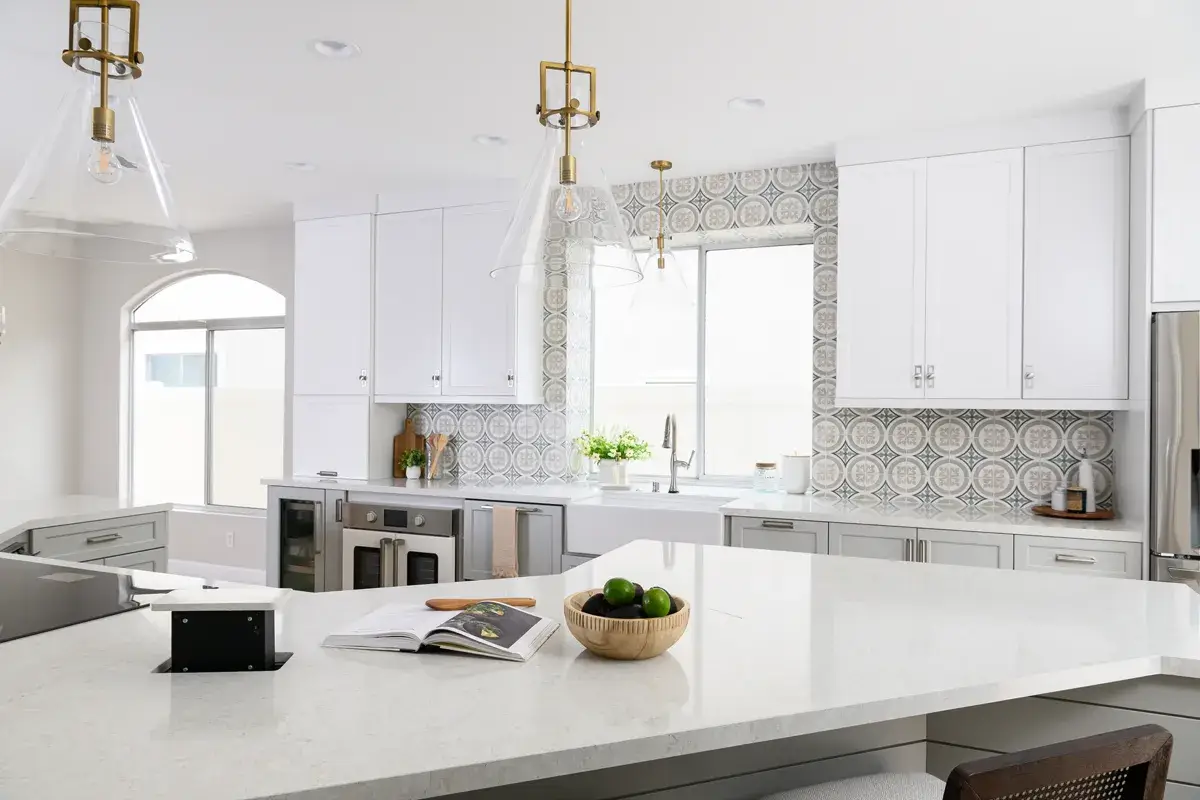 A hidden pop-up outlet in a kitchen island stows away neatly out of sight when not in use